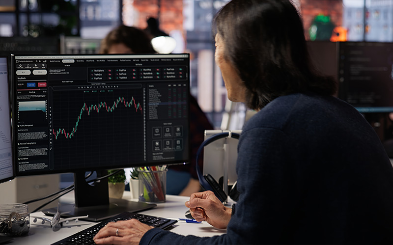 A close-up view of a trader monitoring consistent trading strategies