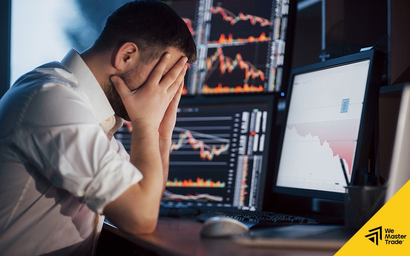 Stressed trader facing losses without proper risk management strategies